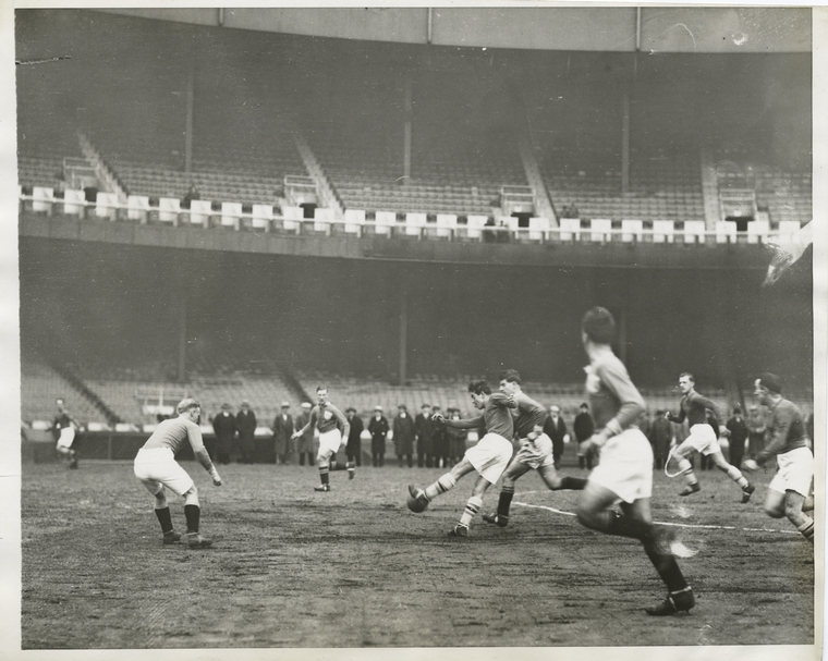 picture from New York Public Library collection "N.Y. Nationals and New Bedford Whalers at Polo Grounds, N.Y.". date unknown (between 1860-1920) two soccer teams playing on the polo grounds, no crowd in the stands.
